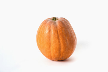 Whole pumpkin and sliced on a white background, vegetarian food, organic, orange, health
