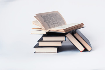 A stack of books lying on a white background, learning, education, study