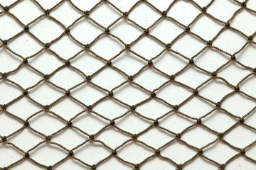 Close up of fish net against white background © naturelovephotos