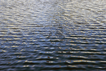 ripples on the blue water of Moscow river close up
