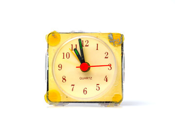 vintage damaged alarm clock on white