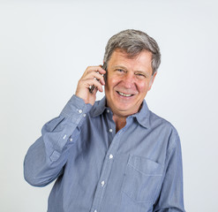 friendly smiling man using the smart phone
