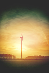 Obraz premium Wind turbine at sunset