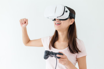 Excited woman play video game with vr device
