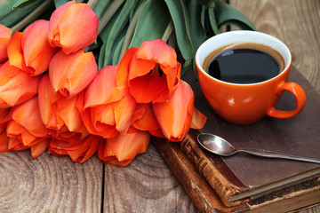 Fototapeta na wymiar ORANGE MORNING! cup of coffee, tulips, old books 