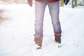 Fototapeta na wymiar winter shoes in snow, close-up