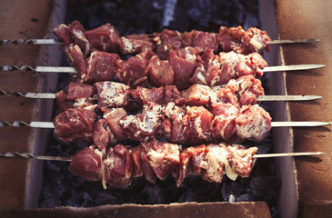 Cooking pork kebab on grill