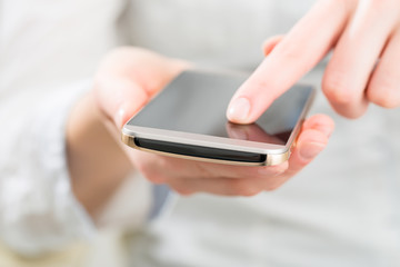 Woman using mobile smart phone.