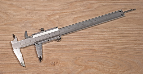 Caliper is on the wood stove.