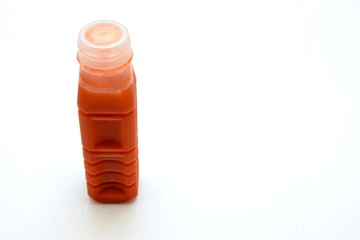 fresh carrot juice in plastic bottle