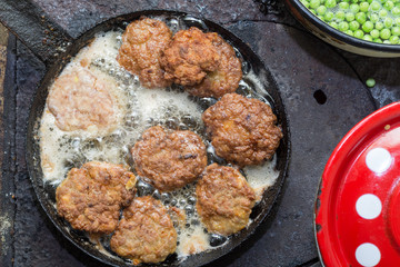 Minced meat burgers frying in the hot oil