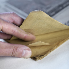 Hand With An Old Book
