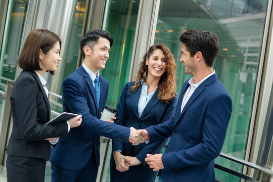 Group Of Business People Make A Deal