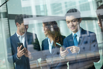 Group of business people use of cellphone