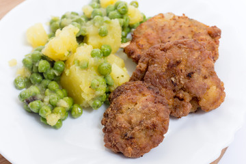 Homemade minced meat burgers from grandmothers kitchen and potat