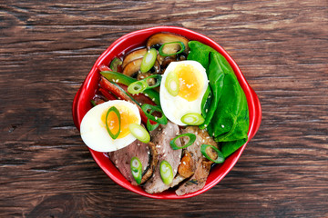 Duck noodles with egg, vegetables and duck meat in bowl
