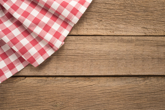   Tablecloth textile on wooden background 
