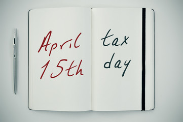 text april 15th tax day in a notepad