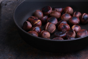 Roasted chestnuts in a pan