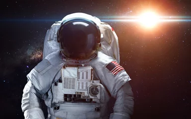 Tuinposter Astronaut in de ruimte. Ruimtewandeling. Elementen van deze afbeelding geleverd door NASA © Vadimsadovski