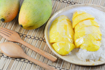 Sweet mango with sticky rice mix with coconut milk
