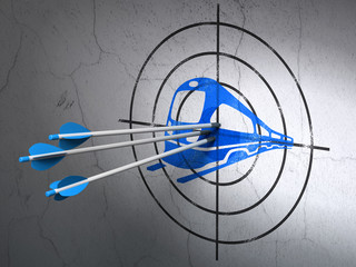 Tourism concept: arrows in Train target on wall background © Maksim Kabakou