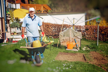 old man is working in his garden - gardening 25