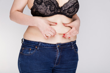 Obraz premium Womans fat belly