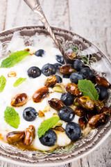 Quark with blueberries, pistachios and mint