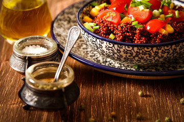 Quinoa with tomatoes chilli and corn on a plate