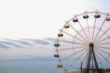 Ferris wheel on sky background