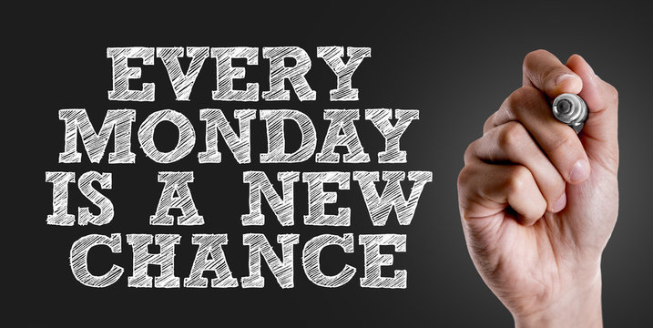 Hand writing the text: Every Monday Is a New Chance