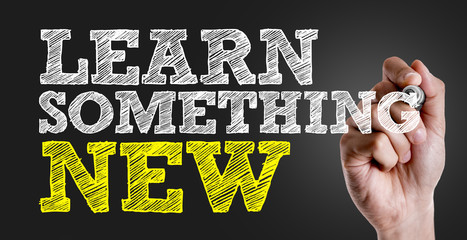 Hand writing the text: Learn Something New