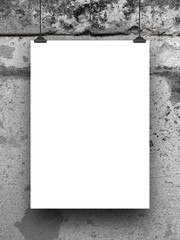 Close-up of one blank frame hanged by clips against old weathered wall background