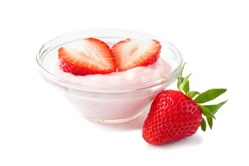  Clear bowl of strawberry flavored yogurt with fresh berries over a white background © Jenifoto