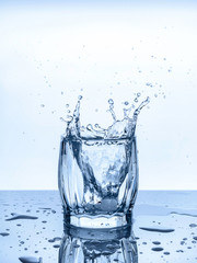 a glass of water ice drops splashes freshness thirst