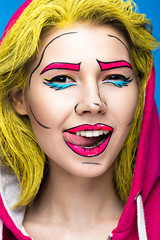 Photo of surprised young woman  with professional comic pop art make-up. Creative beauty style. 