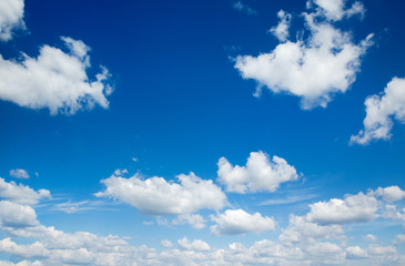 Naklejka na ściany i meble white fluffy clouds in the blue sky