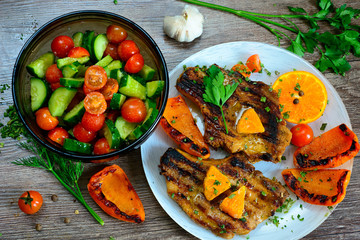 steak with grilled next to a vegetable salad