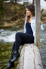 Woman tourist on a wooden bridge