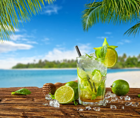 Summer drink with blur beach on background