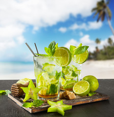 Summer drinks with blur beach on background