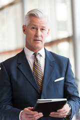 senior business man working on tablet computer