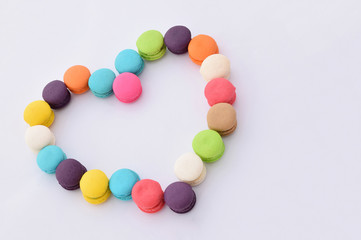 Abstract soft focus of colorful french macaron on white background.