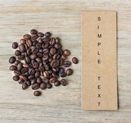 coffee bean and price tag on wooden background