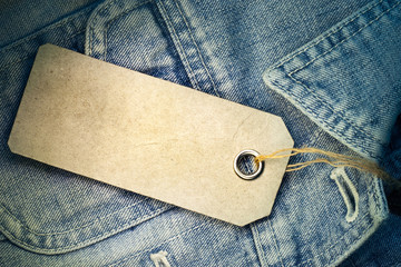 price tag at jeans blue background