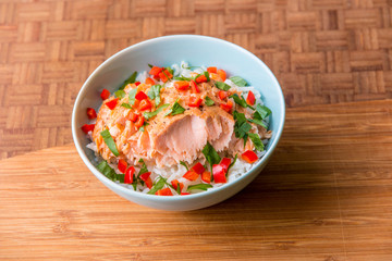 Bowl of rice with poached salmon