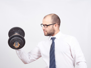 Naklejka premium Man Trained businessman raises dumbbell.
