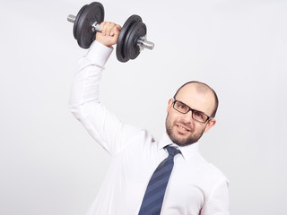 Naklejka premium Man Trained businessman raises dumbbell.