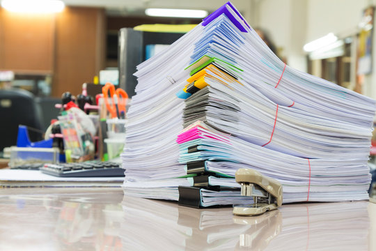 Stack of business papers on office desk